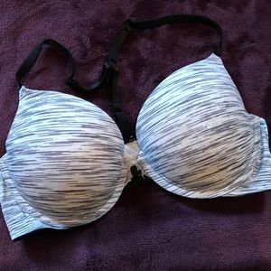 Striped racer back bra that has a front clasp